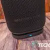 Detailed front view of the Monster DNA Max portable Bluetooth speaker with wireless charging on the wireless charging base. Detailed front view of the Monster DNA Max portable Bluetooth speaker with wireless charging on the wireless charging base