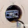The Ultraloq U-Bolt Pro Wifi Smart Deadbolt exterior assembly and connector cable fed through deadbolt. The Ultraloq U-Bolt Pro Wifi Smart Deadbolt exterior assembly and connector cable fed through deadbolt