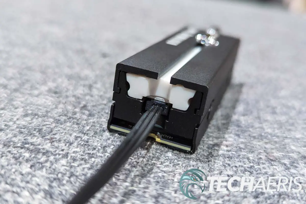 The aRGB cable and port on the end of the Seagate Lightsaber Legends Special Edition FireCuda PCIe Gen4 NVMe SSD