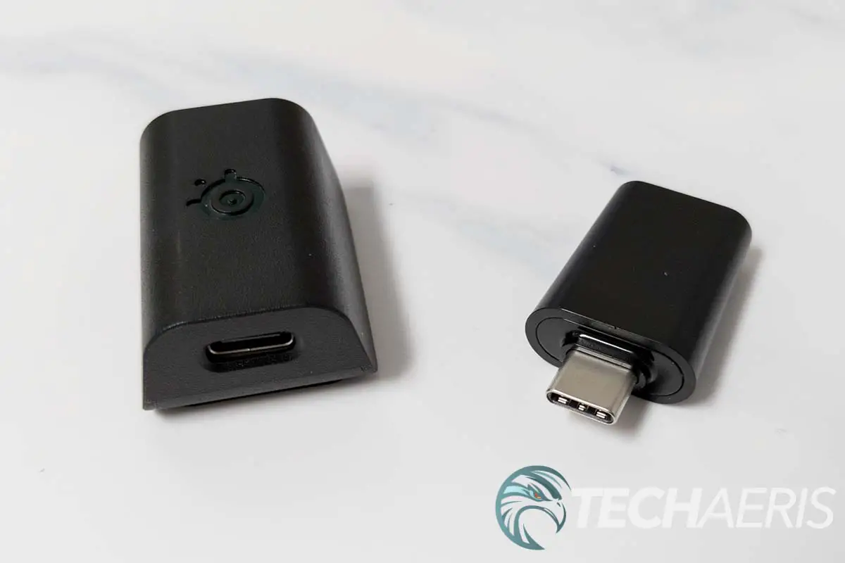 The USB Type-C 2.4GHz wireless dongle and extension adapter included with the SteelSeries Aerox 5 Wireless gaming mouse