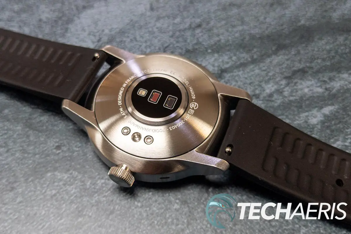 The sensors and charging receptacles on the bottom of the Withings ScanWatch hybrid fitness smartwatch